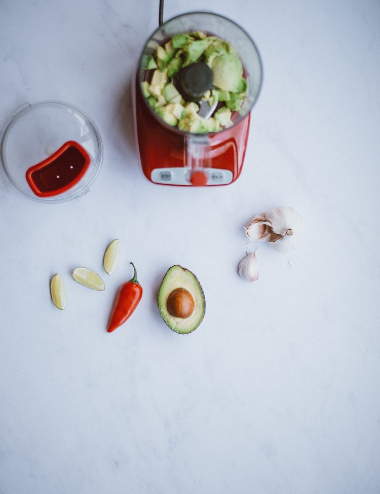 An overhead view of a blender with ingredients.