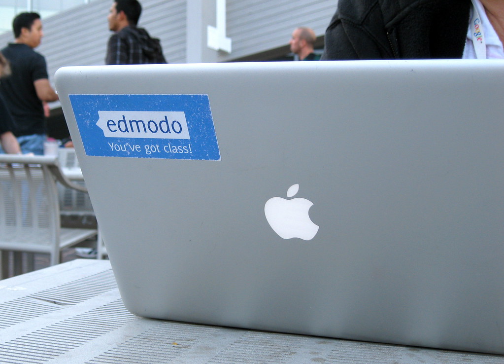 An Apple laptop bears an Edmodo sticker which reads "You've got class."