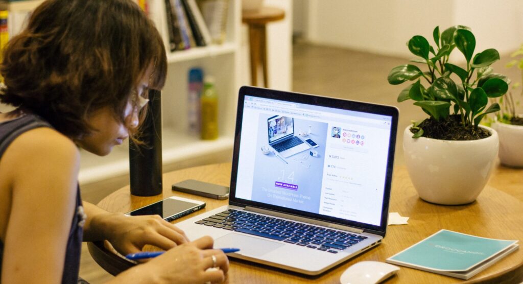 Woman browsing on her laptop.